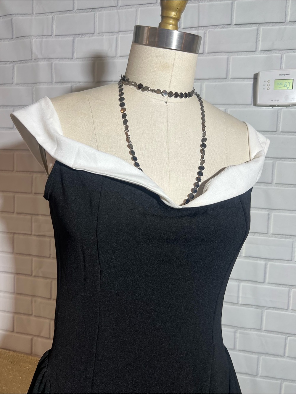 Elegant Black One-Shoulder Dress with White Folded Collar